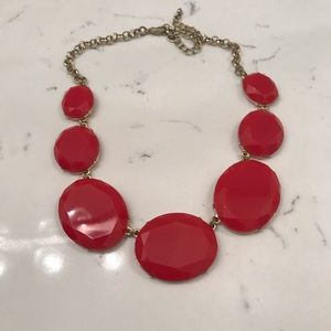Red linked statement necklace.